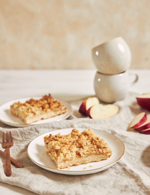 Delicious homemade apple cake with crumble on a white table